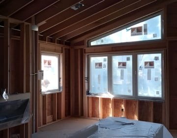 Interior wall framing prepared for professional spray foam insulation installation in a residential space