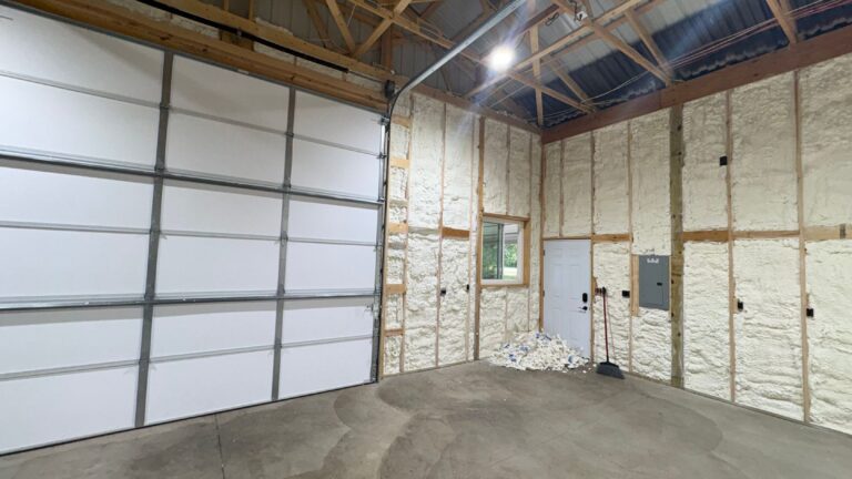 Spray foam insulated pole barn garage walls with overhead doors and a window, Southeast Michigan