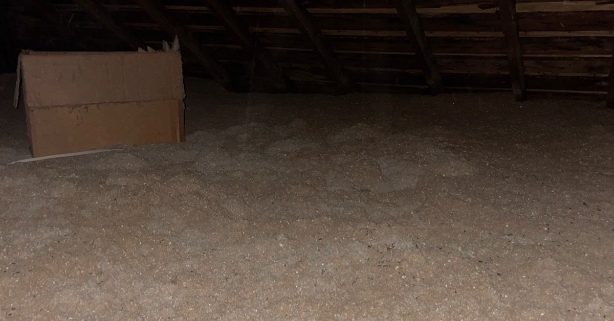 Blown-in attic insulation installed to proper depth