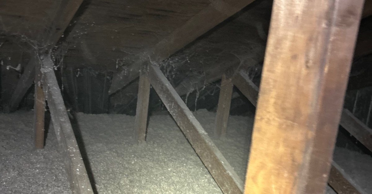 Blown-in attic insulation being installed in Michigan
