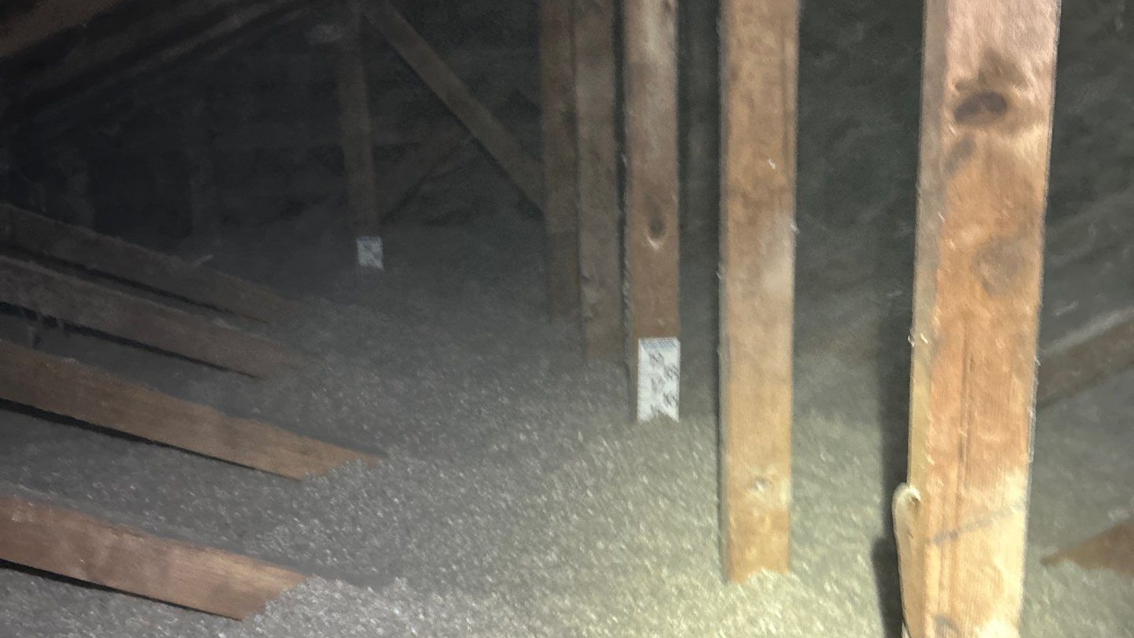 Loose-fill attic insulation installed in a Michigan home